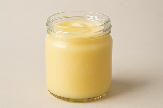 glass jar of beef tallow slgihtly colord yellow